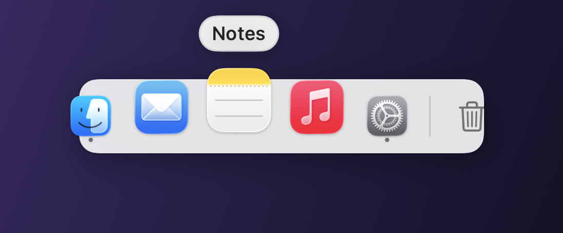 A Pier dock with app icons, one magnified under the pointer, running indicators, a divider and the Trash